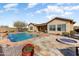 Backyard pool with fire pit and flagstone patio at 3735 W Links Dr, Phoenix, AZ 85086