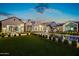 Expansive backyard oasis with a sparkling pool, outdoor kitchen, and lush lawn at 3827 E Marlette Ave, Paradise Valley, AZ 85253