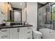 Contemporary bathroom with soaking tub and dark vanity at 3827 E Marlette Ave, Paradise Valley, AZ 85253