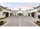 Stunning white farmhouse exterior with a large courtyard and multiple garages at 3827 E Marlette Ave, Paradise Valley, AZ 85253