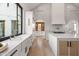 Modern kitchen with marble countertops, farmhouse sink, and ample storage at 3827 E Marlette Ave, Paradise Valley, AZ 85253