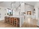 Gourmet kitchen boasts expansive island, high-end appliances, and white cabinetry at 3827 E Marlette Ave, Paradise Valley, AZ 85253