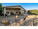 Relaxing backyard patio with seating area, grill, and brick pavers at 4290 E Strawberry Dr, Gilbert, AZ 85298