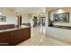 Elegant entryway with a granite-topped counter and views to a living room at 5117 N Cortez Rd, Apache Junction, AZ 85119