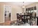 Bright dining area features a modern table with seating for four and sliding glass doors at 5433 E Dodge St, Mesa, AZ 85205