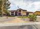 Beautiful two-story home featuring desert landscaping with stone path to front door at 5613 W West Wind Dr, Glendale, AZ 85310