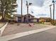 Charming two-story home with desert landscaping and an American flag at 5613 W West Wind Dr, Glendale, AZ 85310