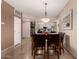 Elegant dining area with a chandelier and six chairs at 7401 W Arrowhead Clubhouse Dr # 1023, Glendale, AZ 85308