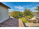Landscaped backyard oasis with lush greenery at 7605 S 18Th Way, Phoenix, AZ 85042
