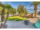 Landscaped backyard with seating area and fire pit at 7605 S 18Th Way, Phoenix, AZ 85042