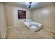 Small bedroom with carpeted floor, double bed, and window with blinds at 7605 S 18Th Way, Phoenix, AZ 85042