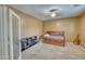 Bedroom with wooden bed frame and built-in shelving at 7605 S 18Th Way, Phoenix, AZ 85042