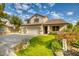 Two-story house with a three-car garage and well-maintained lawn at 7605 S 18Th Way, Phoenix, AZ 85042