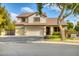 Two-story house with a three-car garage and manicured lawn at 7605 S 18Th Way, Phoenix, AZ 85042