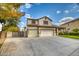 Two-story house with a three-car garage and spacious driveway at 7605 S 18Th Way, Phoenix, AZ 85042