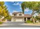 Two-story house with a three-car garage and landscaped yard at 7605 S 18Th Way, Phoenix, AZ 85042