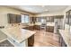 U-shaped kitchen with granite countertops and stainless steel appliances at 7605 S 18Th Way, Phoenix, AZ 85042