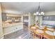 Modern kitchen with granite countertops and dark wood cabinets at 7605 S 18Th Way, Phoenix, AZ 85042