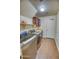 Laundry room with washer, dryer, and additional shelving at 7605 S 18Th Way, Phoenix, AZ 85042