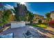 Outdoor kitchen and putting green in backyard at 7605 S 18Th Way, Phoenix, AZ 85042