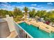 Inviting backyard pool with spacious patio and lush landscaping at 7605 S 18Th Way, Phoenix, AZ 85042