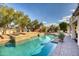 Relaxing pool area with stonework and landscaping at 7605 S 18Th Way, Phoenix, AZ 85042