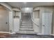 Elegant curved staircase with carpeted steps at 7605 S 18Th Way, Phoenix, AZ 85042