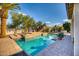 Inviting swimming pool with stonework and landscaping at 7605 S 18Th Way, Phoenix, AZ 85042