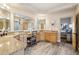 Charming bathroom featuring a double sink vanity, granite countertops and makeup vanity at 8220 E Cavalry Dr, Scottsdale, AZ 85266