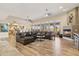 Spacious living room featuring hardwood floors, a fireplace, an open layout, and seamless indoor-outdoor flow at 8220 E Cavalry Dr, Scottsdale, AZ 85266