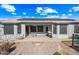 Covered back patio features solar panels above, a dining table, and a fire pit at 8479 E Sunrise Sky Dr, Gold Canyon, AZ 85118