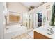 Bright bathroom with a soaking tub, glass enclosed shower, and vanity at 8479 E Sunrise Sky Dr, Gold Canyon, AZ 85118