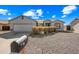 Well-maintained home with desert landscaping and a two-car garage at 8479 E Sunrise Sky Dr, Gold Canyon, AZ 85118