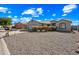 Charming home with desert landscaping and a three-car garage, located on a well-maintained lot at 8479 E Sunrise Sky Dr, Gold Canyon, AZ 85118