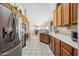 Bright kitchen with stainless steel appliances, light wood cabinets, and tile flooring at 8479 E Sunrise Sky Dr, Gold Canyon, AZ 85118