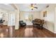 Inviting living room with hardwood floors, ceiling fan, and a grand piano at 8479 E Sunrise Sky Dr, Gold Canyon, AZ 85118