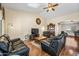 Cozy living room featuring hardwood floors, ceiling fan, and vaulted ceilings at 8479 E Sunrise Sky Dr, Gold Canyon, AZ 85118
