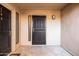 Inviting front entrance with security door, modern light fixture, and contemporary design at 9270 E Mission Ln # 117, Scottsdale, AZ 85258