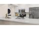 Updated kitchen with stainless appliances, quartz countertops, and modern washer/dryer at 9270 E Mission Ln # 117, Scottsdale, AZ 85258
