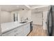 Contemporary kitchen featuring new appliances, quartz countertops, and white cabinetry at 9270 E Mission Ln # 117, Scottsdale, AZ 85258