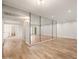 Open living room featuring tile floors, mirrored wall, and an open doorway to another room at 9270 E Mission Ln # 117, Scottsdale, AZ 85258