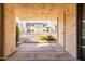 Covered patio offering views of the community pool and landscaping at 9270 E Mission Ln # 117, Scottsdale, AZ 85258