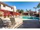 Community pool with vibrant bougainvillea and plenty of lounge chairs, creating an inviting atmosphere at 9270 E Mission Ln # 117, Scottsdale, AZ 85258