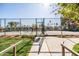 Well-maintained tennis courts surrounded by lush landscaping, perfect for active recreation at 9270 E Mission Ln # 117, Scottsdale, AZ 85258