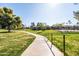 Scenic walking path through the community with views of the well-maintained landscaping at 9270 E Mission Ln # 117, Scottsdale, AZ 85258