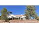 House exterior, featuring a tiled roof and landscaping at 980 W Santa Fe Dr, Wickenburg, AZ 85390