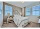 Charming bedroom with a full-size bed and stylish geometric accent wall at 10144 E Ursula Ave, Mesa, AZ 85212