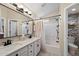 Clean bathroom featuring dual sinks, white cabinetry, and modern fixtures at 10306 E Rising Sun Pl, Gold Canyon, AZ 85118