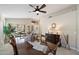 Cozy dining area with a large table, neutral walls, decorative accents, and bright natural light at 10306 E Rising Sun Pl, Gold Canyon, AZ 85118