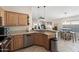 Open kitchen view into the living space featuring stainless steel appliances and tile floors at 10306 E Rising Sun Pl, Gold Canyon, AZ 85118